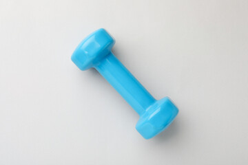 Blue vinyl dumbbell on light background, top view