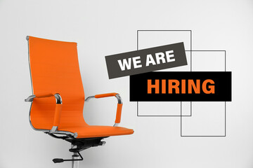 Orange office chair and text WE`RE HIRING on white background