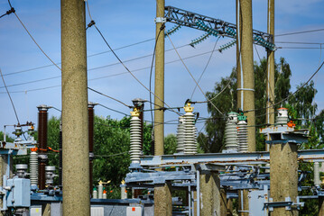 High voltage power transformer substation.High voltage electric power transformers in the blue...