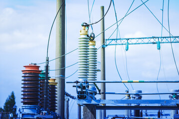 High voltage power transformer substation.High voltage electric power transformers in the blue...