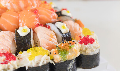 Assorted sushi nigiri and maki big set on slate. A variety of Japanese sushi with tuna, crab, salmon, eel and rolls. Top view. Image of japan food. selective focus.