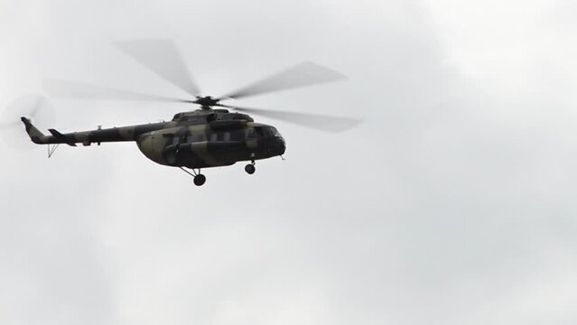 Afghan Air Force Mi-17 military transport helicopter flying overcast Afghanistan