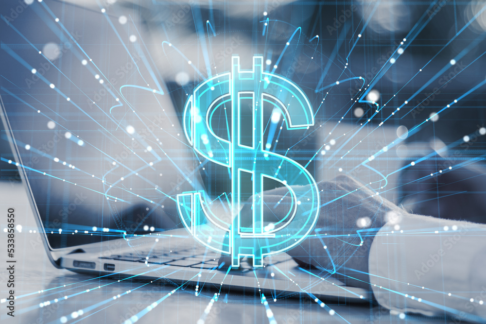 Poster close up of hands using laptop keyboard with creative glowing dollar hologram with metaverse lines o