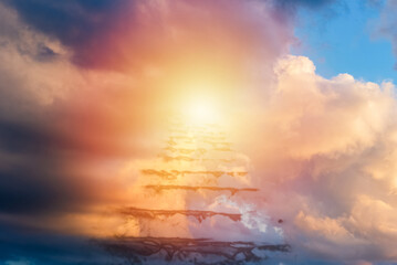 Beautiful religious background.Sunset or sunrise with clouds,stairs to heaven,bright light from...
