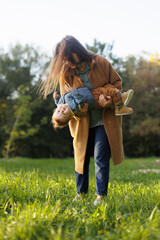 mother and son in the park first steps