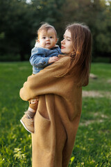 mother and son in the park first steps