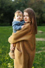 mother and son in the park first steps