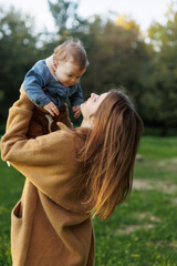 mother and son in the park first steps