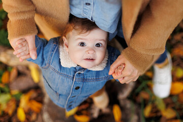 mother and son in the park first steps