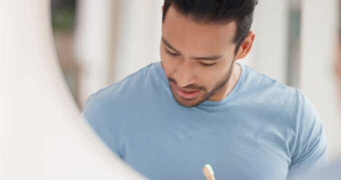 Happy, mirror and beauty with man in bathroom for cosmetics, facial or dental hygiene with morning routine. Cleaning, wellness or grooming with young guy and face skin, toothbrush or toothpaste