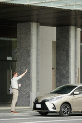 Businessman Catching Taxi