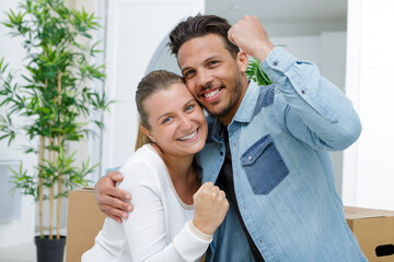 young couple doing a yes gesture