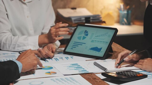 Business team collaboration discussing working analyzing with financial data and marketing growth report graph in team, presentation and brainstorming to strategy planning making profit of company