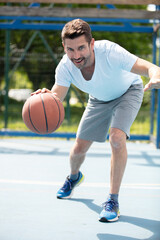 basketball player is playing outdoors