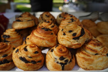 Freshly baked sweet buns with raisins.