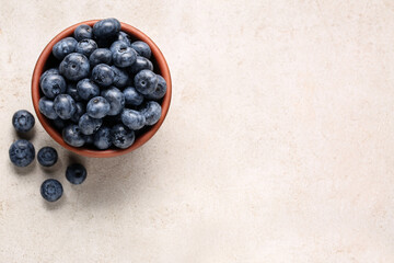Tasty fresh blueberries on light table, flat lay. Space for text