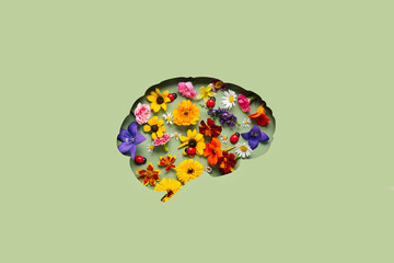 Paper cut brain and flowers on green background. Mental health concept