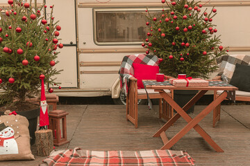 New Year's location near the motor home. Christmas holidays in nature. Christmas tree near the house.