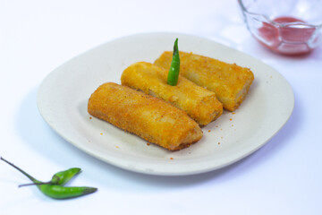 Indonesia food (risoles) on white background with sauce