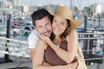 portrait of couple with a marine background