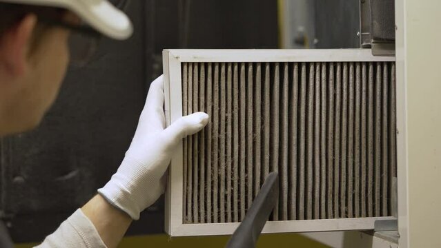hvac filter replacing. Replacing the filter in the central ventilation system, furnace. Replacing Dirty Air filter for home central air conditioning system. Change filter in rotary heat exchanger