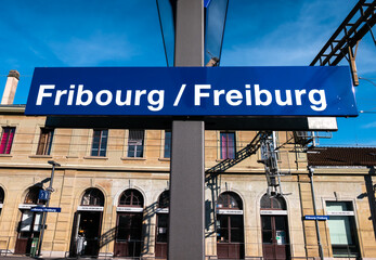 Fribourg, Switzerland - August 31, 2022: Railway station board in Fribourg - Freiburg, one of the best preserved medieval old towns in Switzerland