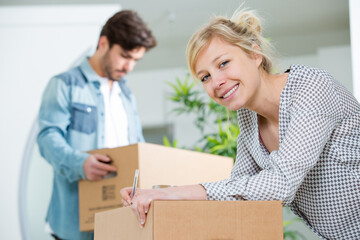 portrait of a couple moving houses