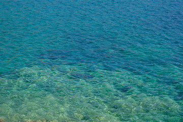 Transparent and clear turquoise water in Ios cyclades Greece