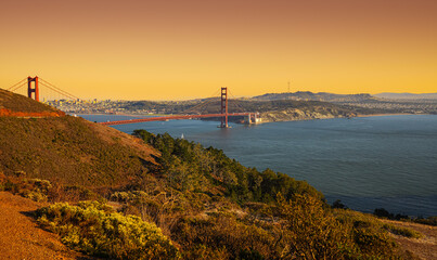 Fototapeta na wymiar Iconic landmark Golden Gate bridge in San Francisco photographed in a beautiful sunset light in California. Travel to America.