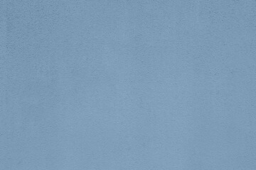 Pastel light blue colored low contrast Concrete textured background. Empty colourful wall texture...