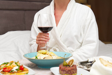 luxury hotel room service, dinner and flowers. Romantic vacation.