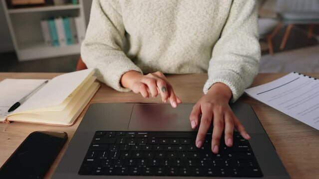 Business woman with hands typing on her laptop at the office, working and sending emails. Write, type and send documents online using a computer. Close up of businesswoman using keyboard in workplace