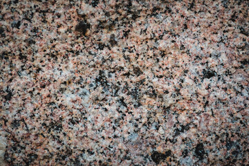 Close-up of grey texture of stones, background. Premium colorful abstract background with dynamic shadow on background, consisting of small stones, gradient colour, artistic texture, epic background