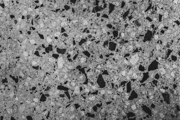 Close-up of grey texture of stones, background. Premium colorful abstract background with dynamic shadow on background, consisting of small stones, gradient colour, artistic texture, epic background