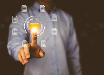 Businessman hand showing electronic document management icon. The concept of accessing online document databases.