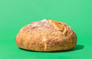 White bread on a green background, close-up