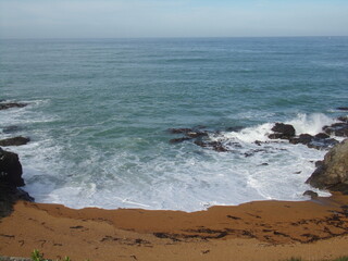 Fototapeta na wymiar Isolated beach coastline with waves