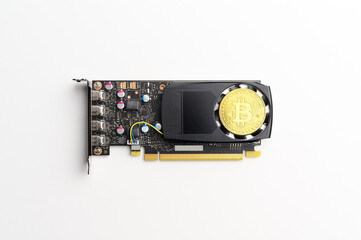 Cryptocurrency Mining Concept. Top view of Bitcoin on video graphics card. Isolated on white background.