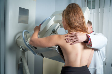 Detect tumors or abnormalities in the breast. Prevention of breast cancer. Advanced medical imaging procedure. Prepare for your mammogram. Breast screening. Young woman examining her breast.