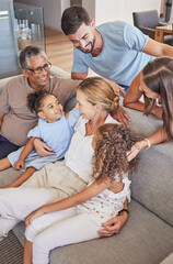 Happy interracial family bonding with their children and grandparents at home. Adults and their...