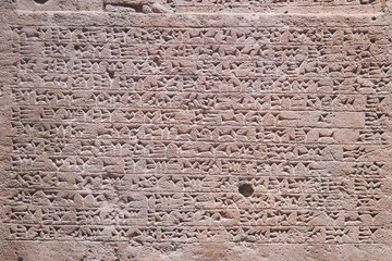 Ancient inscriptions on stone, close-up. Historical research and archaeology.