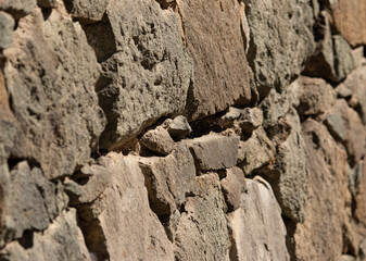 old stones form a wall as a background
