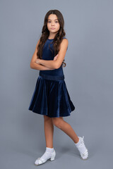 Full length of beautiful teenage girl in dress standing and posing over gray background.