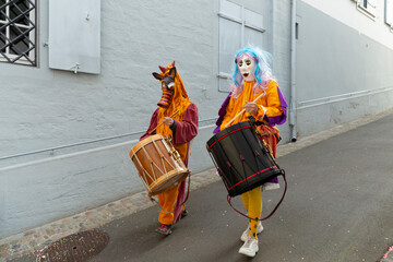 Switzerland, Basel, 7 March 2022.  Close-up of a small disguised pair of snare drummers - obrazy, fototapety, plakaty