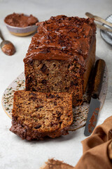 bread with zucchini, bananas and chocolate on a light background