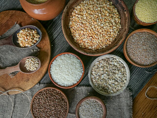 Various groats, cereals. Different types of groats in bowls, close up. Healthy nutrition food