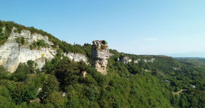 Monastery on top of a stone pillar. The pillar of Katskhi in Georgia. The Spaso-Voznesensky Monastery on the top of the pillar. The drone flies forward to the statue.