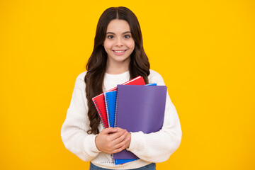 Teenager school girl with books isolated studio background. Happy face, positive and smiling emotions of teenager girl.