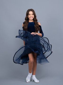 12, 13, 14 Year Old Girl With Dress On Gray Isolated Studio Background. Elegant Teenager Child Girl In Fashion Ball Dress. Movement Dress Of Young Child Teen Girl.