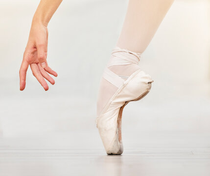 Closeup Of Dancer Foot On Floor, Ballet Shoe And Hand, Show Posture And Balance At Dance Class. Zoom Of Woman Dancing In Studio To Practice Or Stage, During Profession Performance Or Recital